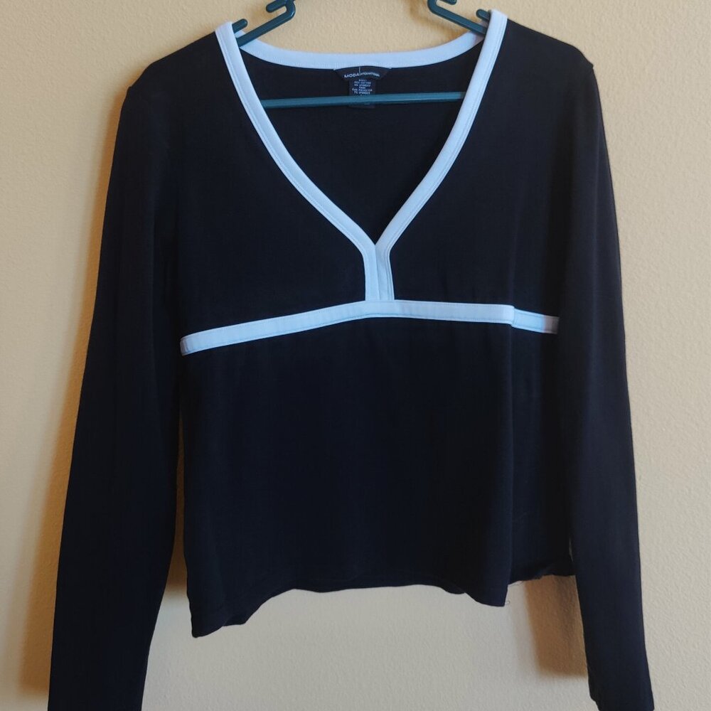 Moda International Black top with White trim. Size Large